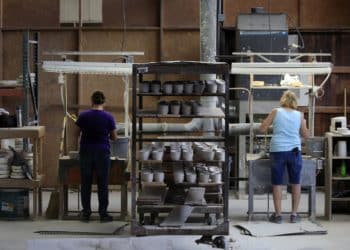 Workers manufacture dinnerware at the Fiesta Tableware Co. factory in Newell, West Virginia, U.S., on Thursday, July 22, 2021. Markit is scheduled to release manufacturing figures on August 2. Photographer: Luke Sharrett/Bloomberg