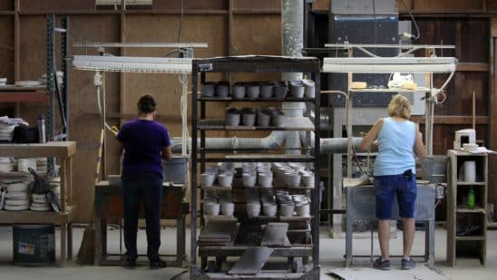 Workers manufacture dinnerware at the Fiesta Tableware Co. factory in Newell, West Virginia, U.S., on Thursday, July 22, 2021. Markit is scheduled to release manufacturing figures on August 2. Photographer: Luke Sharrett/Bloomberg