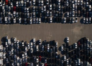 Rental cars are stored in a parking lot at Dodger Stadium in this aerial photograph taken over Los Angeles, California, U.S., on Wednesday, May 27, 2020. Hertz Global Holdings Inc. will sell as many of its rental cars as possible while in bankruptcy to bring its huge fleet in line with reduced future demand in a post-pandemic economy,the company's lead bankruptcy lawyer said during a court hearing Wednesday.