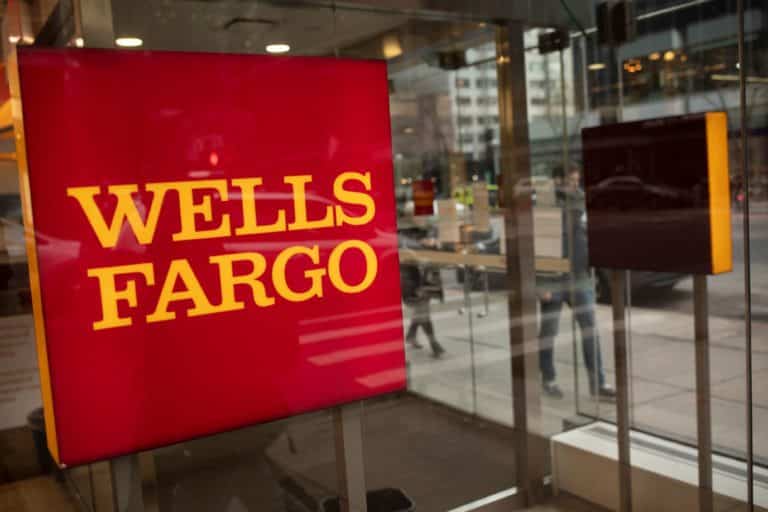 Signage at a Wells Fargo bank branch in New York, U.S., on Thursday, Jan. 13, 2022. Wells Fargo & Co. said it expects a key measure of lending to pick up this year, a sign that clients are starting to take on debt again as government stimulus wanes.