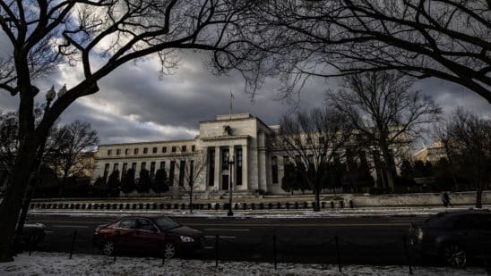 Fed downshifts to half-point hike, sees 5.1% rate next year