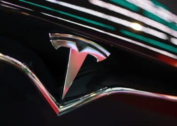 The Tesla Inc. logo is seen on the grille of a Model X electric vehicle at the Moscow Tesla Club in Moscow. Photographer: Andrey Rudakov/Bloomberg