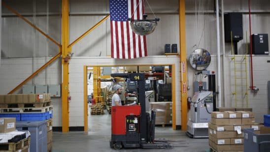 A worker operates a forklift at a manufacturing facility in Virginia Beach, Virginia. Photographer: Luke Sharrett/Bloomberg