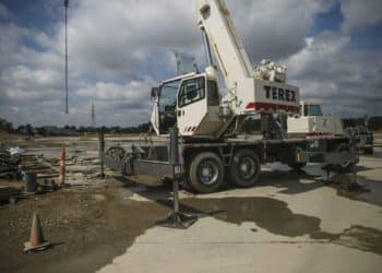 A Terex Corp. crane sits on the construction site of the American Mobility Center (ACM) in Ypsilanti, Michigan, U.S., on Tuesday, Aug. 15, 2017. Representative Debbie Dingel, a Democrat from Michigan, and Representative Bob Latta, a Republican from Ohio, visited the ACM to meet with experts in the autonomous vehicles industry as the two work together to advance bipartisan self-driving vehicle legislation through the House floor.