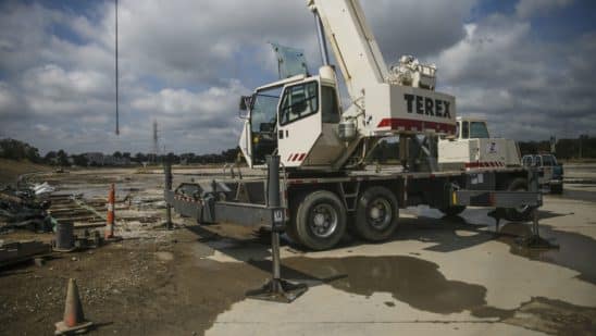 A Terex Corp. crane sits on the construction site of the American Mobility Center (ACM) in Ypsilanti, Michigan, U.S., on Tuesday, Aug. 15, 2017. Representative Debbie Dingel, a Democrat from Michigan, and Representative Bob Latta, a Republican from Ohio, visited the ACM to meet with experts in the autonomous vehicles industry as the two work together to advance bipartisan self-driving vehicle legislation through the House floor.