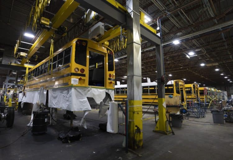 The Lion C electric school bus is assembled at the Lion Electric assembly plant in Saint-Jerome, Quebec, Canada, on Thursday, Oct. 13, 2022. Lion Electric Co. designs, develops, manufactures, and distributes purpose-built all-electric medium and heavy-duty urban vehicles, including seven mid range truck and bus models. Photographer: Christinne Muschi/Bloomberg