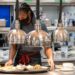 An employee works inside the kitchen at a hotel in New York.