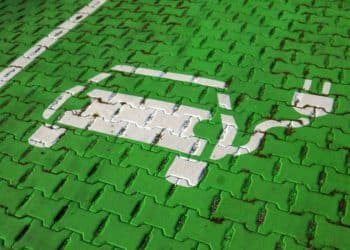 An electric car stencil symbol sits on a parking space at the electric vehicle charging site in Hanover, Germany.