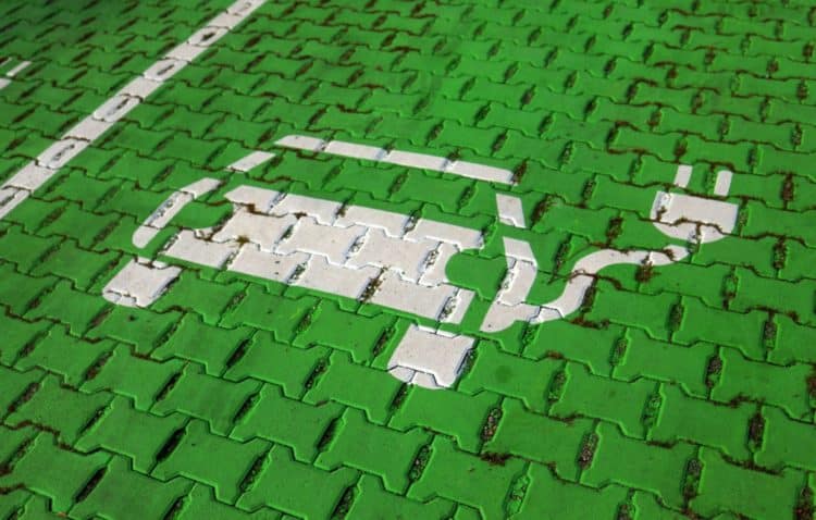 An electric car stencil symbol sits on a parking space at the electric vehicle charging site in Hanover, Germany.