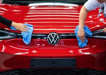 Employee conducts quality control checks on a Volkswagen AG (VW) ID.5 electric sports utility vehicle (eSUV) on the assembly line at the automaker's electric automobile plant in Zwickau, Germany, on Tuesday, April 26, 2022. The Zwickau assembly lines are the centerpiece of a plan by VW, the world's biggest automaker, to manufacture as many as 330,000 cars annually.