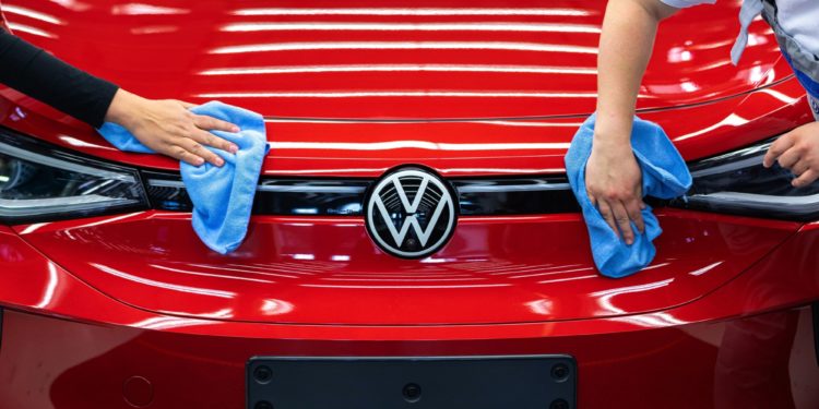 Employee conducts quality control checks on a Volkswagen AG (VW) ID.5 electric sports utility vehicle (eSUV) on the assembly line at the automaker's electric automobile plant in Zwickau, Germany, on Tuesday, April 26, 2022. The Zwickau assembly lines are the centerpiece of a plan by VW, the world's biggest automaker, to manufacture as many as 330,000 cars annually.