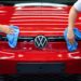 Employee conducts quality control checks on a Volkswagen AG (VW) ID.5 electric sports utility vehicle (eSUV) on the assembly line at the automaker's electric automobile plant in Zwickau, Germany, on Tuesday, April 26, 2022. The Zwickau assembly lines are the centerpiece of a plan by VW, the world's biggest automaker, to manufacture as many as 330,000 cars annually.