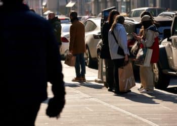 Pedestrians carry shopping bags in the SoHo neighborhood of New York, US, on Sunday, Feb. 26, 2023. Spending by the youngest group of US adults has been turbocharged by two once-in-a-generation drivers over the past year: decades-high inflation and a tight job market that has propelled strong wage growth, especially at entry levels.