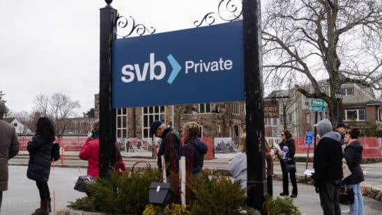 Customers stand waiting in line outside a Silicon Valley Bank branch in Wellesley, Massachusetts, US, on Monday, March 13, 2023. The collapse ofSilicon Valley Bankhas prompted aglobal reckoningat venture capital and private equity firms, which found themselves suddenly exposed all together to the tech industrys money machine.