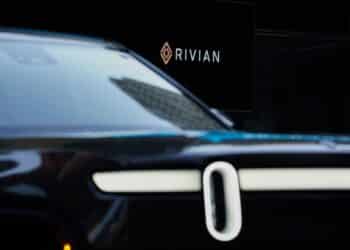 Rivian signage during the company's IPO outside the Nasdaq MarketSite in New York, U.S., on Wednesday, Nov. 10, 2021. Electric vehicle-maker Rivian Automotive Inc. priced shares in its initial public offering at $78 apiece to raise about $11.9 billion, the biggest first-time share sale this year.
