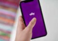 The Ally Financial Inc. logo on a smartphone arranged in Saint Thomas, Virgin Islands, United States, on Friday, Jan. 22, 2021. Ally Financial Inc. fell 5.3%, more than any full-day loss since June 26 as its sector declined.