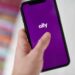 The Ally Financial Inc. logo on a smartphone arranged in Saint Thomas, Virgin Islands, United States, on Friday, Jan. 22, 2021. Ally Financial Inc. fell 5.3%, more than any full-day loss since June 26 as its sector declined.