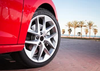 Close up of a car tire on a red car