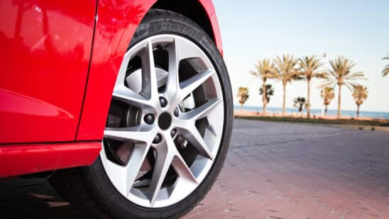 Close up of a car tire on a red car