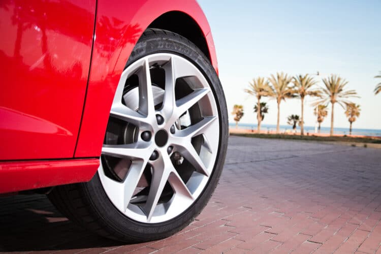 Close up of a car tire on a red car