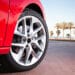 Close up of a car tire on a red car