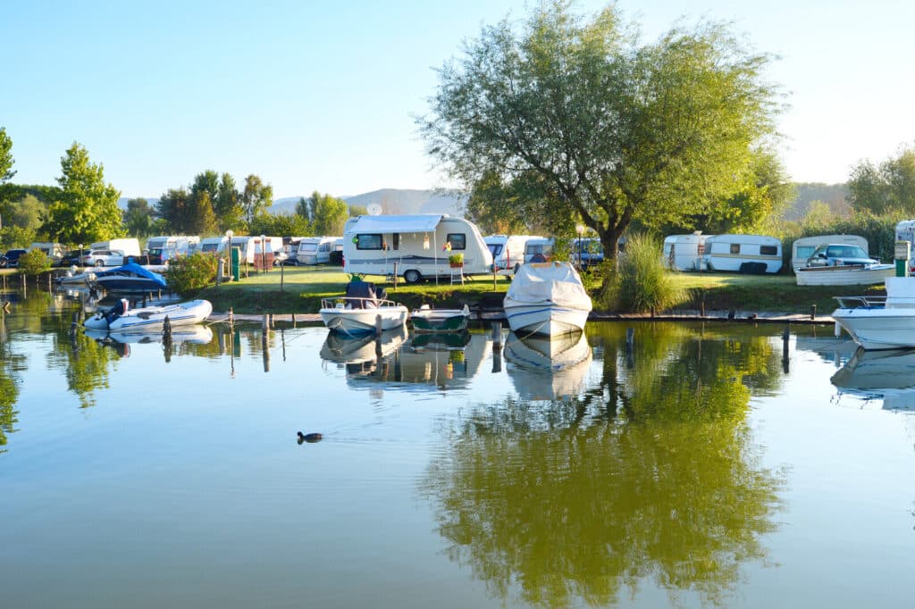 RVs and marine vehicles at an outdoor recreational area.