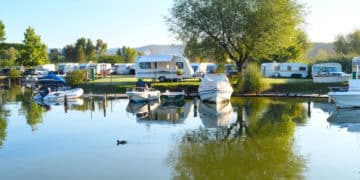 RVs and marine vehicles at an outdoor recreational area.