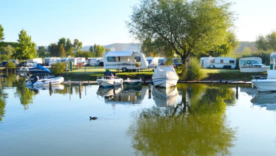 RVs and marine vehicles at an outdoor recreational area.