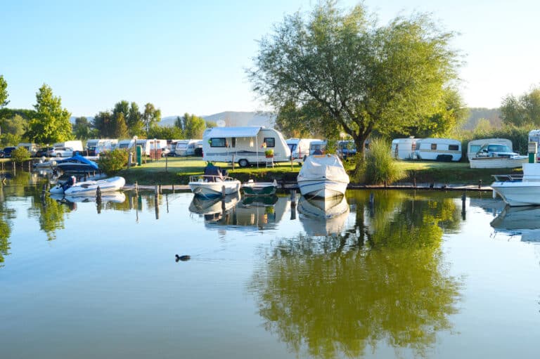 RVs and marine vehicles at an outdoor recreational area.