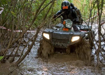 ATV riding through mud