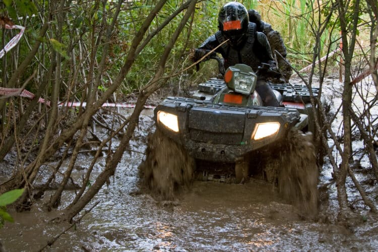 ATV riding through mud