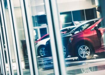 Cars lined up in dealership showroom