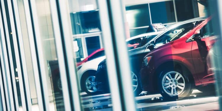 Cars lined up in dealership showroom