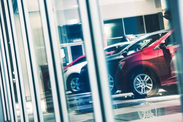 Cars lined up in dealership showroom