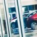 Cars lined up in dealership showroom