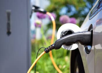 Close up of a charger plugged into an electric vehicle