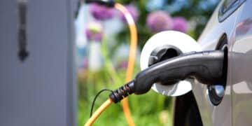 Close up of a charger plugged into an electric vehicle