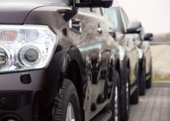 Close up of the headlight of a black SUV