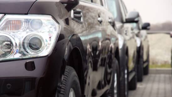 Close up of the headlight of a black SUV