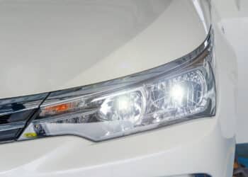 Front headlight of a white car