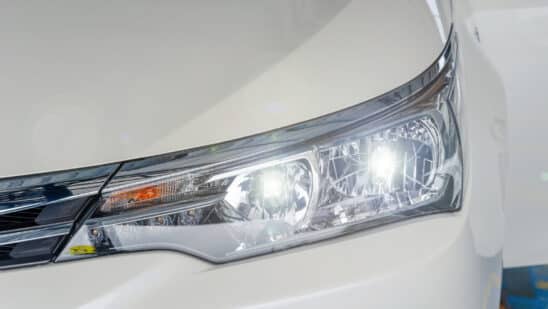 Front headlight of a white car