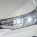 Front headlight of a white car