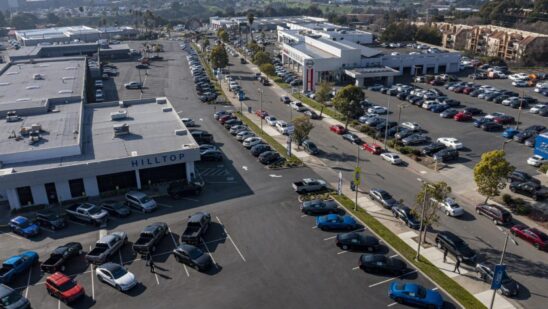 A Ford dealership in Richmond, California, U.S., on Wednesday, Jan. 26, 2022. U.S. auto sales will climb just 3.4% this year to 15.4 million cars and trucks as the semiconductor shortages continue to constrain vehicle inventory, auto dealers predict.