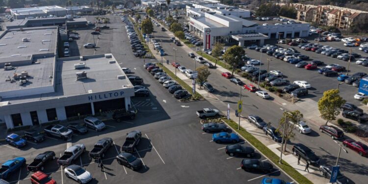 A Ford dealership in Richmond, California, U.S., on Wednesday, Jan. 26, 2022. U.S. auto sales will climb just 3.4% this year to 15.4 million cars and trucks as the semiconductor shortages continue to constrain vehicle inventory, auto dealers predict.