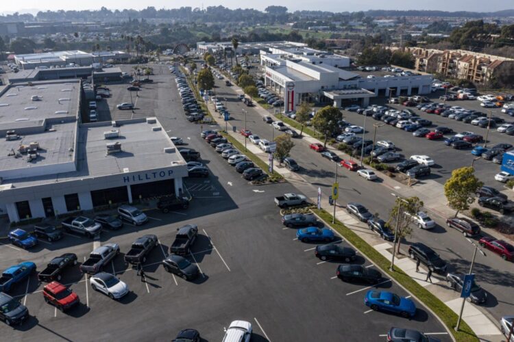 A Ford dealership in Richmond, California, U.S., on Wednesday, Jan. 26, 2022. U.S. auto sales will climb just 3.4% this year to 15.4 million cars and trucks as the semiconductor shortages continue to constrain vehicle inventory, auto dealers predict.