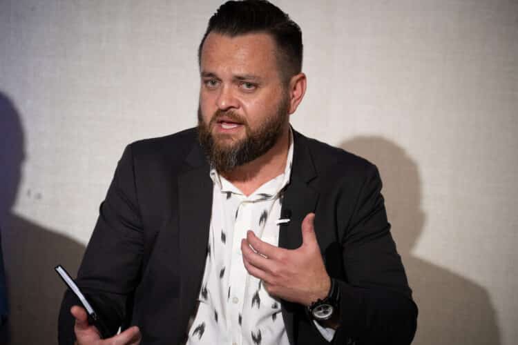Landon Starr, Chief Risk and Information Officer at Arivo Acceptance speaking during a panel discussion at Auto Finance Summit East. Photographer: The Point Media Co./Auto Finance News