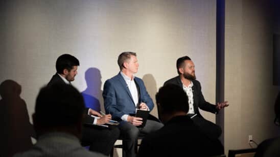 Landon Starr, Chief Risk and Information Officer at Arivo Acceptance (R), sits with Mark Cromer, Chief Operations and Technology Officer at Farm Bureau Bank (middle), and Riley Wolfbauer of Auto Finance News (L) for a panel discussion Auto Finance Summit East.