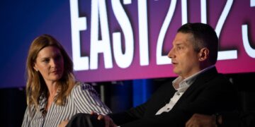 Heidi Burn, Flagship Credit Acceptance, sits with Anthony Capizanno, Axos Bank, during a panel discussion at Auto Finance Summit East in Nashville.