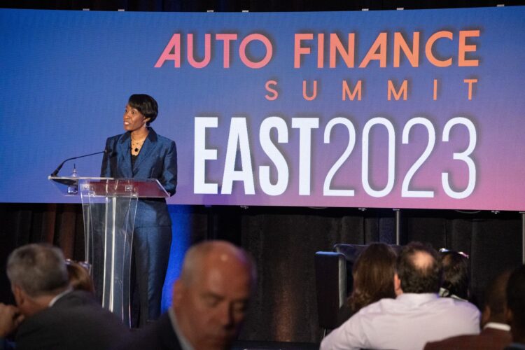 Virnitia Dixon stands at the podium at Auto Finance Summit East