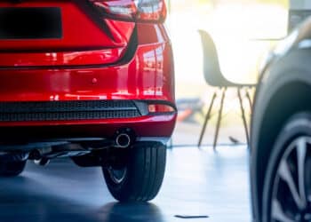 red car in dealership showroom